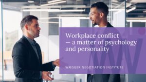 Two men in a workplace conflict openly arguing in the workplace.